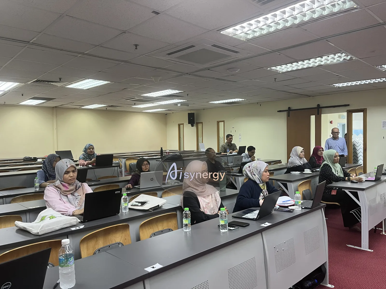 Participants from different departments seated together during a session