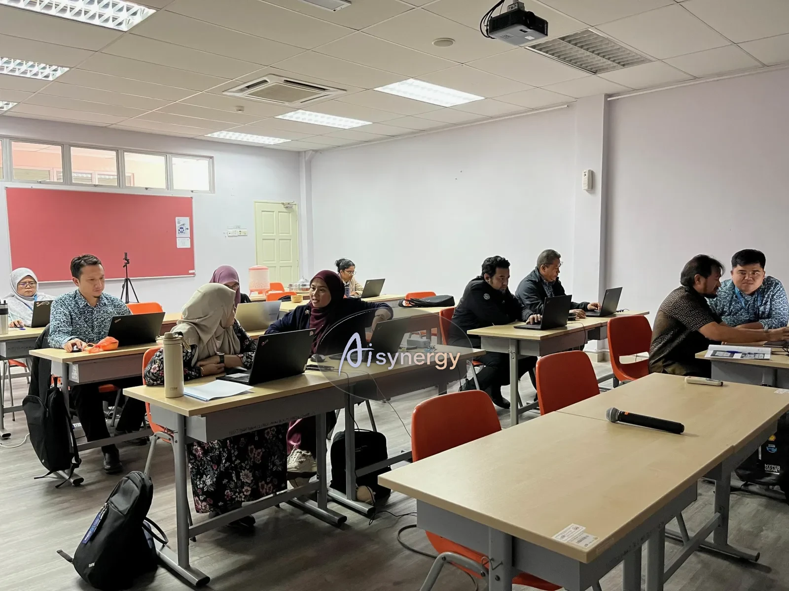 Group workshop session with participants at desks