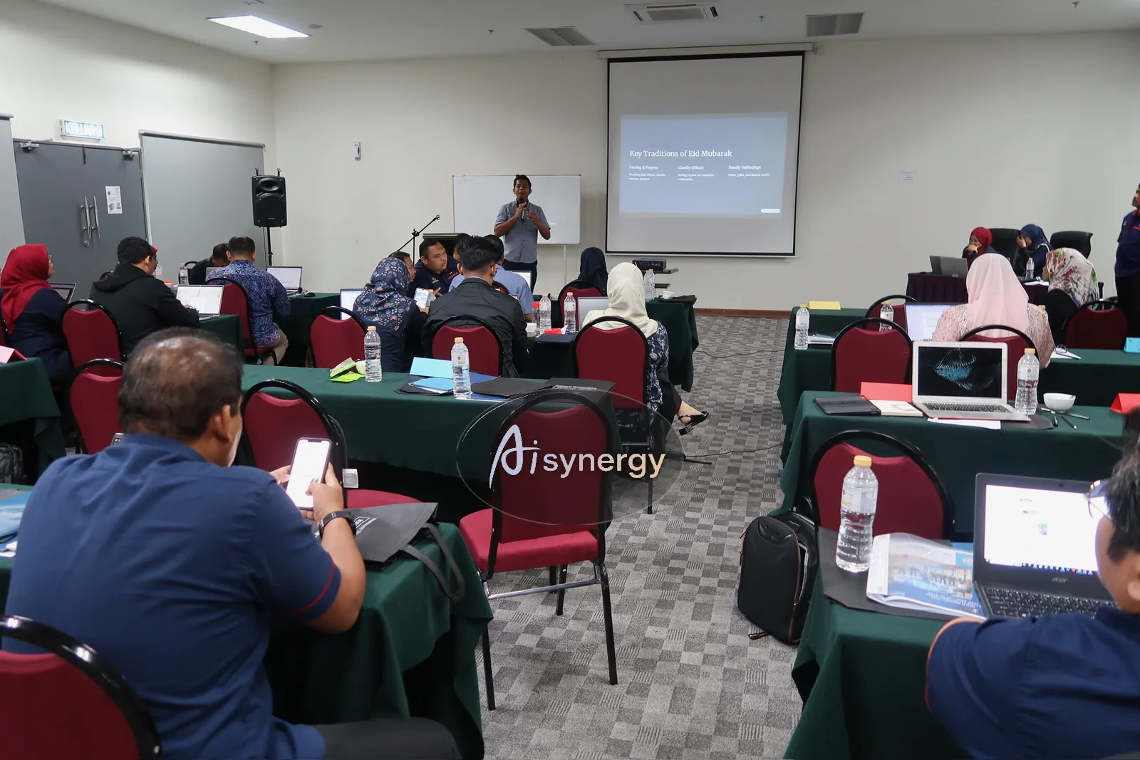 An officer presenting slides they produced during the session to the rest of the room