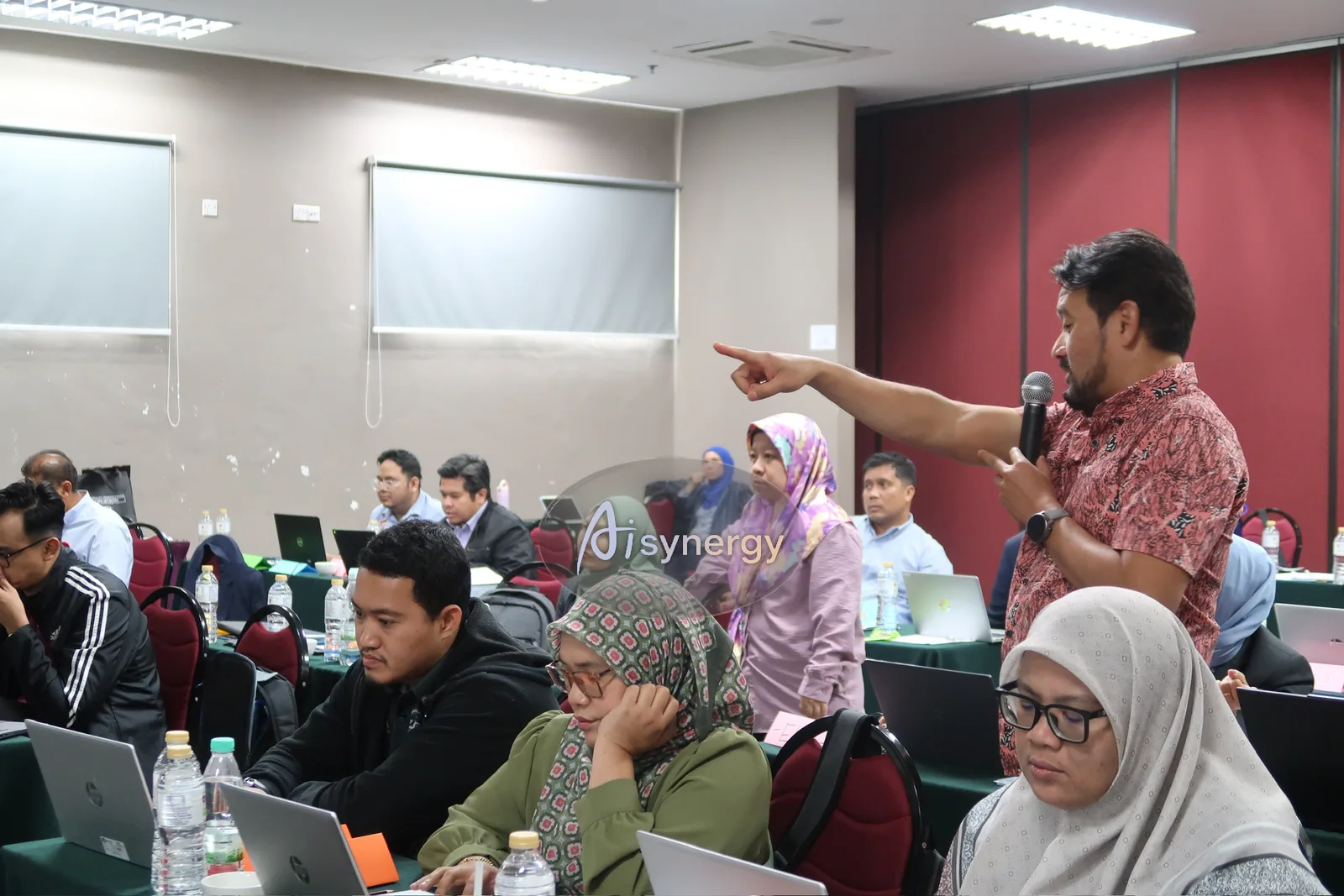 Trainer taking questions from officers during a live training session